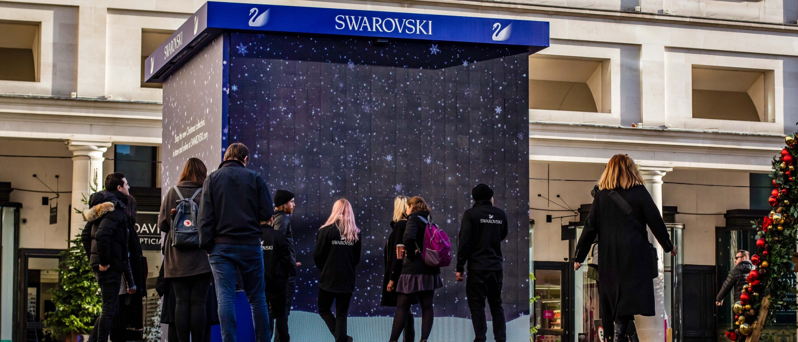 Swarovski event staff around the Experiential LED cube in Covert Garden