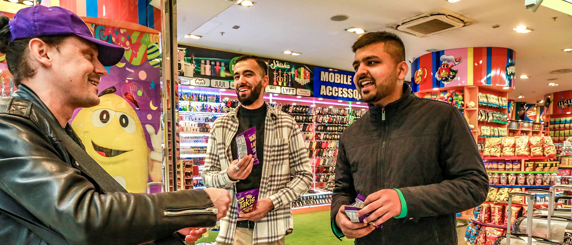 Takis promotional staff handing two two samples