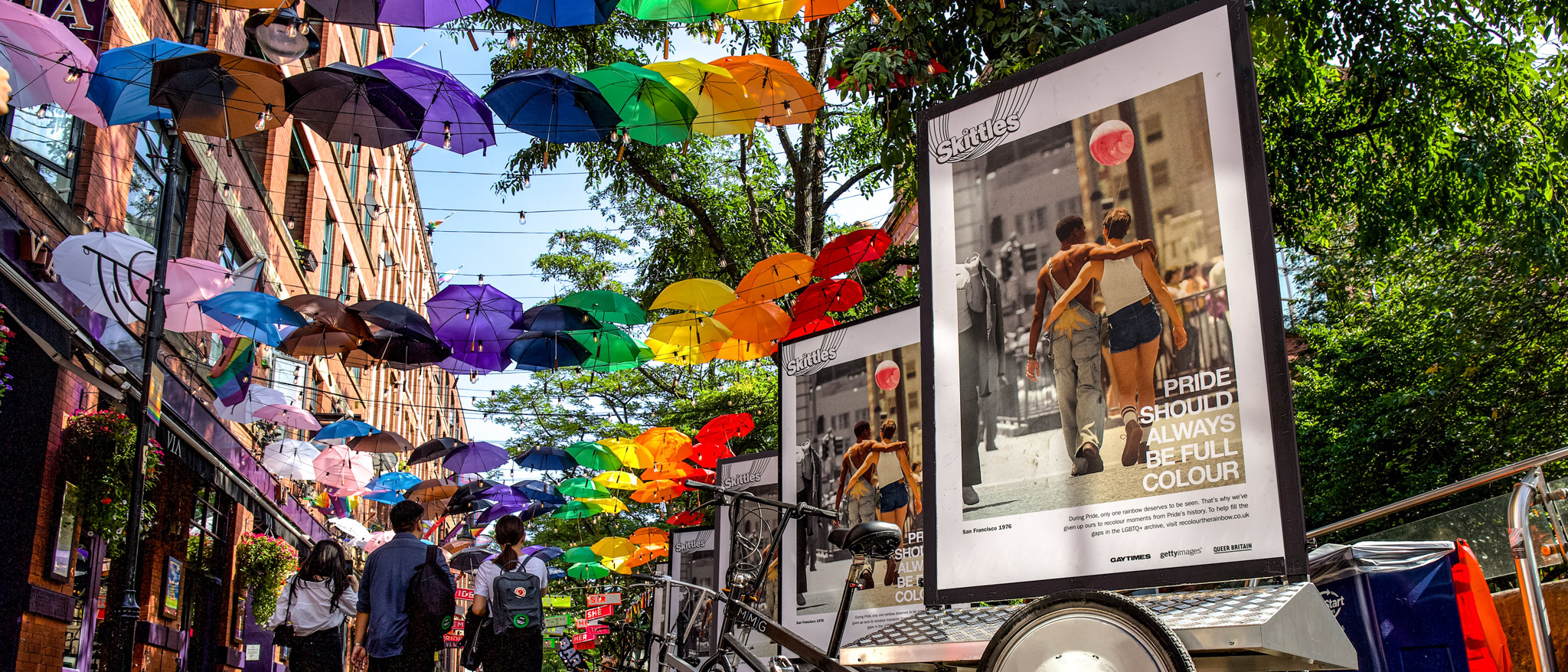 Rainbow Umbrellas over a pedestrian walkway for Pride